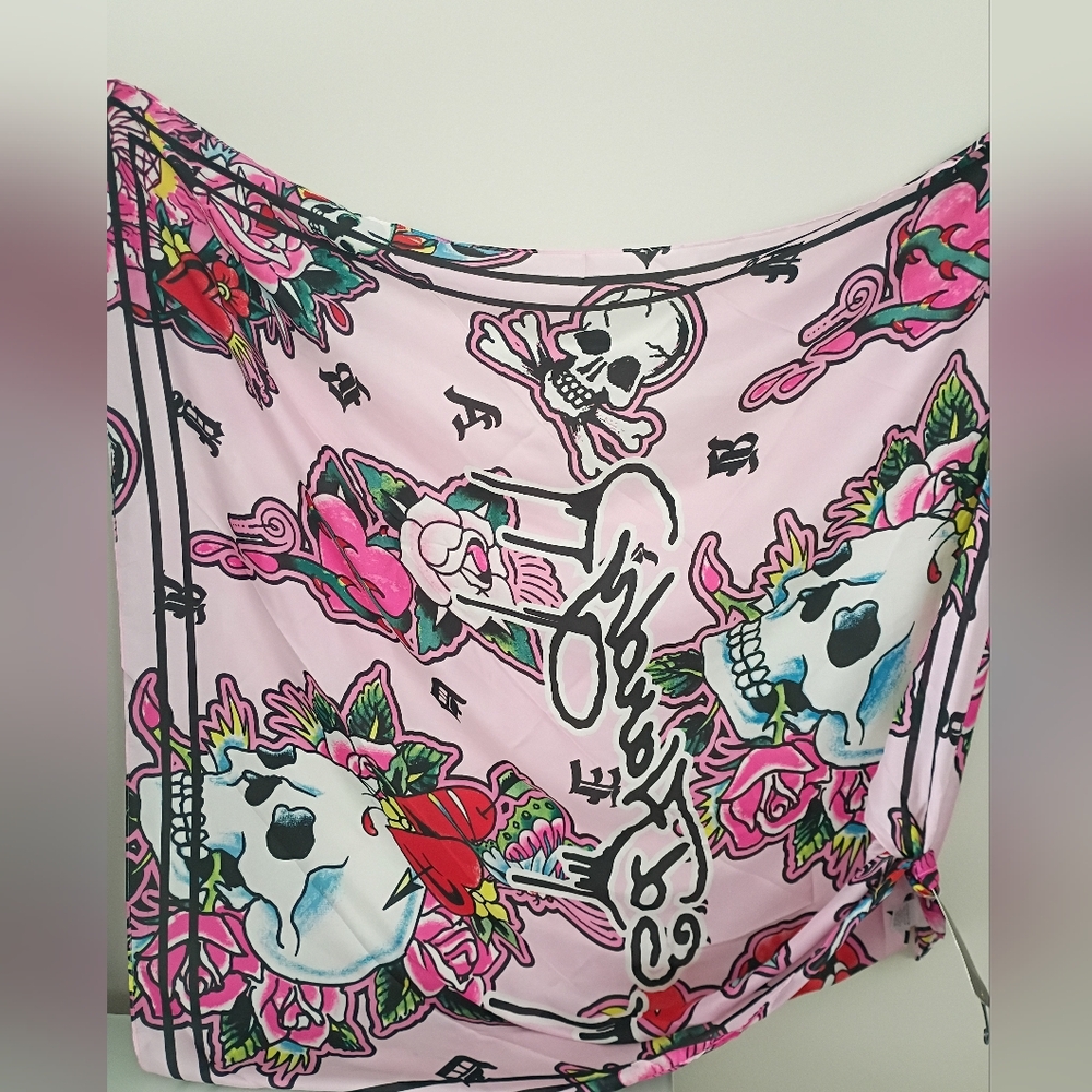 New Ed Hardy pink, multi-function scarf with a skull and roses tattoo print.